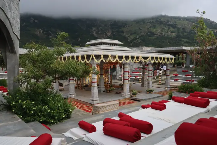 A wedding pavilion framed by misty green hills