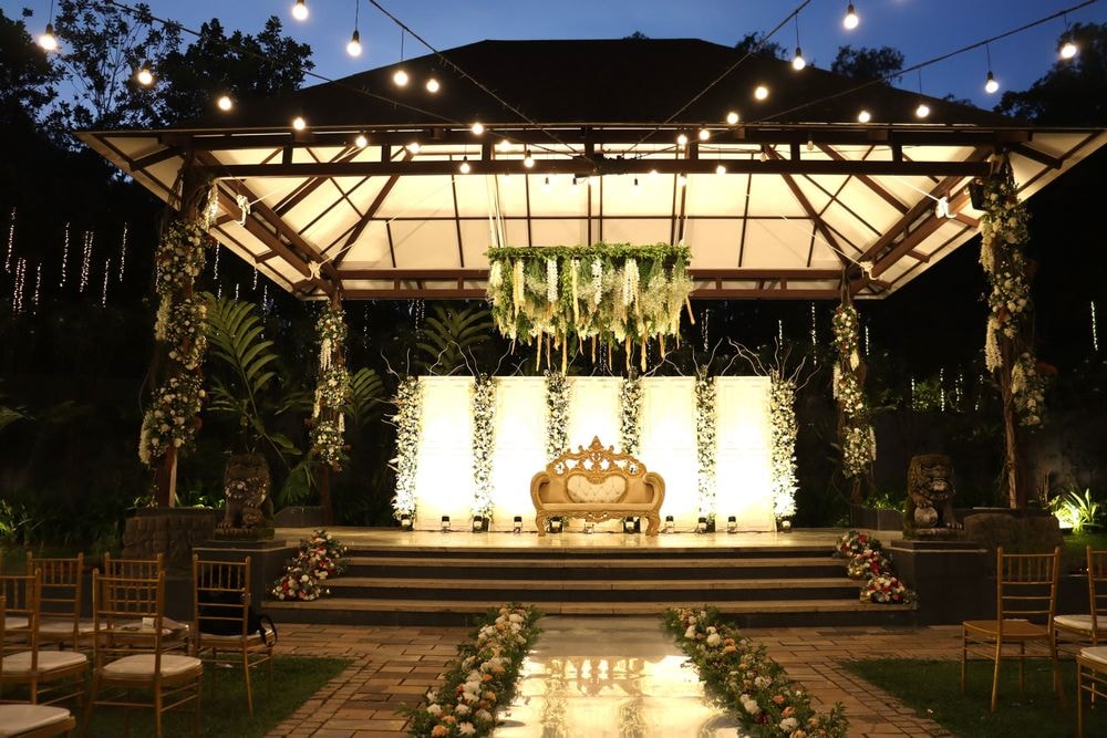 Decorated wedding venue and mandap by Meragi